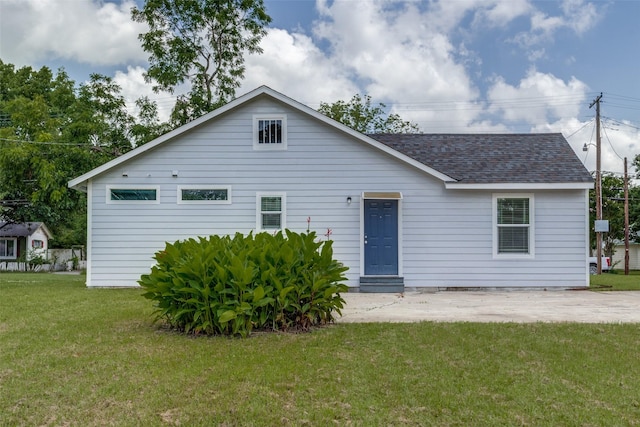 606 E 12th St, Bonham, TX 75418 - view of front of home with a shingled roof, a front yard, and a patio area
