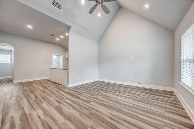 606 E 12th St, Bonham, TX 75418 - unfurnished living room featuring lofted ceiling, a ceiling fan, light wood-type flooring, and recessed lighting