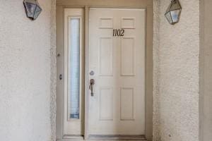 2835 Keller Springs Rd Unit 1102, Carrollton, TX 75006 - property entrance with stucco siding
