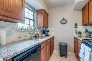 2835 Keller Springs Rd Unit 1102, Carrollton, TX 75006 - kitchen with black dishwasher, electric range, decorative backsplash, and brown cabinetry