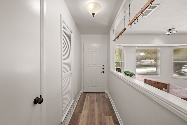 1814 Mary Dr, Euless, TX 76040 - doorway to outside featuring wood finished floors and baseboards