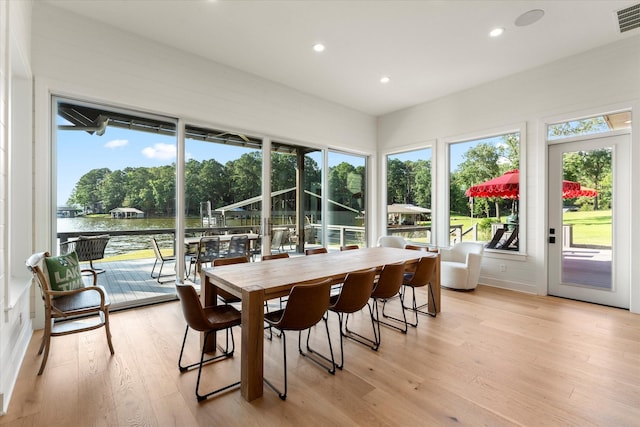 548 Winding Ln, Mount Vernon, TX 75457 - sunroom / solarium with wood finished floors, recessed lighting, a water view, and view of scattered trees