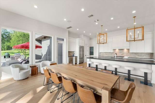 548 Winding Ln, Mount Vernon, TX 75457 - dining space with a chandelier, recessed lighting, and light wood finished floors
