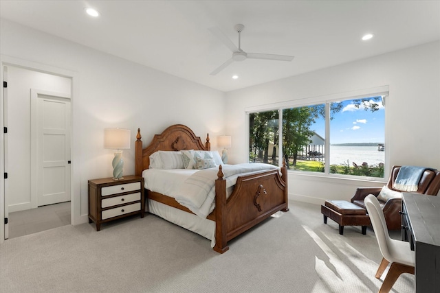 548 Winding Ln, Mount Vernon, TX 75457 - bedroom with recessed lighting, light colored carpet, ceiling fan, and a water view