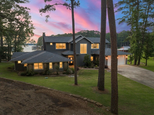 548 Winding Ln, Mount Vernon, TX 75457 - view of front of house featuring concrete driveway, board and batten siding, a front yard, roof with shingles, and a garage