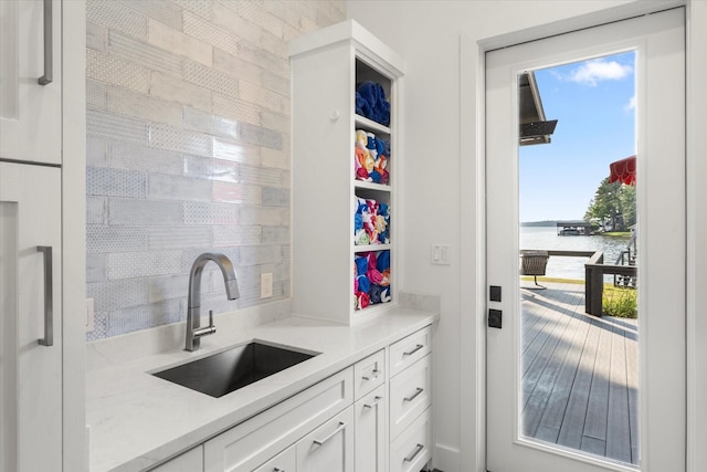 548 Winding Ln, Mount Vernon, TX 75457 - kitchen with a water view, white cabinets, and light countertops