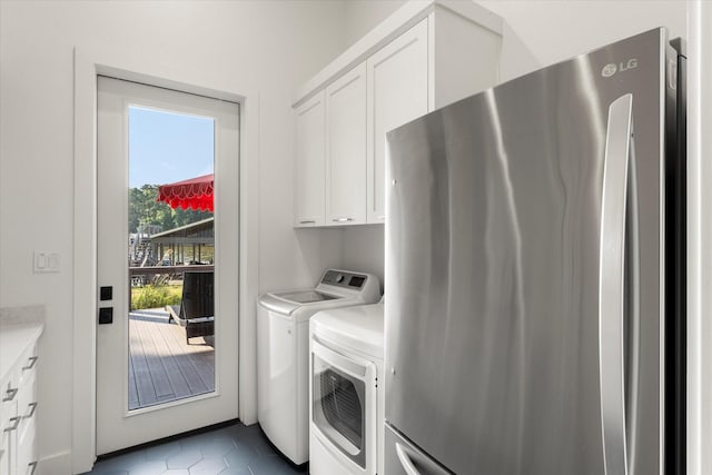 548 Winding Ln, Mount Vernon, TX 75457 - laundry area with cabinet space, separate washer and dryer, and dark tile patterned floors