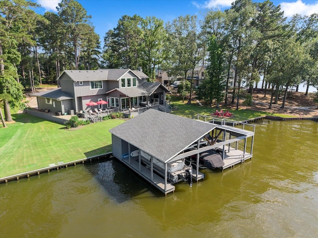 548 Winding Ln, Mount Vernon, TX 75457 - dock featuring boat lift, a deck with water view, and a lawn
