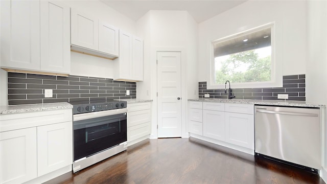 108 Frierson St, Waxahachie, TX 75165 - kitchen with appliances with stainless steel finishes, dark wood-type flooring, white cabinets, light stone counters, and backsplash
