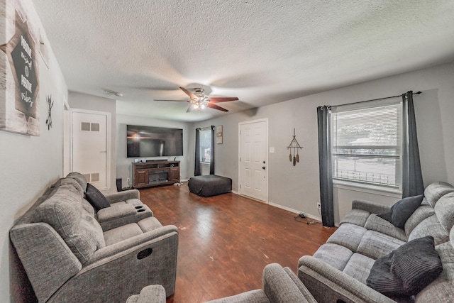 1106 Sunnyvale Dr, Arlington, TX 76010 - living room with ceiling fan, wood finished floors, and a textured ceiling