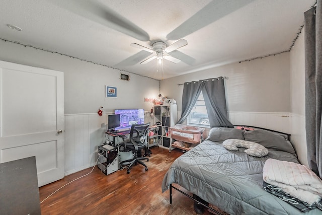 1106 Sunnyvale Dr, Arlington, TX 76010 - bedroom featuring a wainscoted wall, wood finished floors, an office area, and ceiling fan