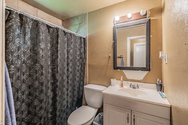 1106 Sunnyvale Dr, Arlington, TX 76010 - bathroom featuring a textured wall, vanity, and a shower with shower curtain