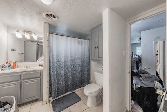 1106 Sunnyvale Dr, Arlington, TX 76010 - full bathroom featuring vanity, tile patterned flooring, ceiling fan, a shower with shower curtain, and a textured ceiling