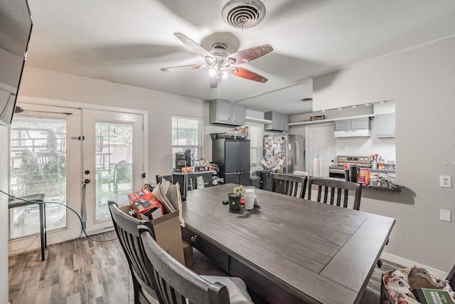 1106 Sunnyvale Dr, Arlington, TX 76010 - dining area with ceiling fan, light wood-style flooring, and french doors
