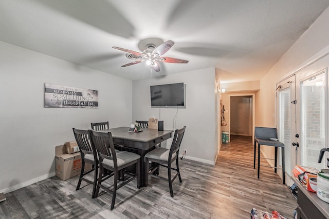 1106 Sunnyvale Dr, Arlington, TX 76010 - dining area with wood finished floors, a ceiling fan, and french doors