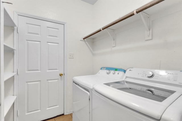 1620 Kawati Way, Krum, TX 76249 - laundry area with washer and dryer and light tile patterned floors