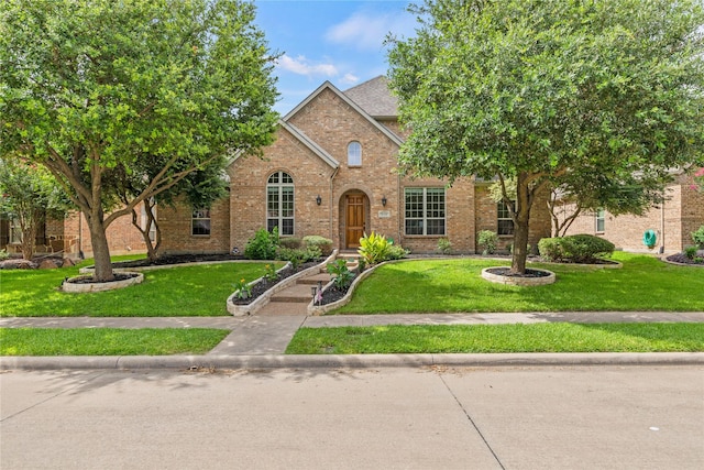 931 N Birdsong Dr, Allen, TX 75013 - view of front of home featuring brick siding and a front lawn
