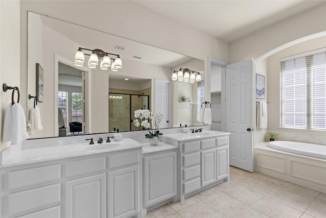 931 N Birdsong Dr, Allen, TX 75013 - full bath with double vanity, a shower stall, tile patterned flooring, and a garden tub