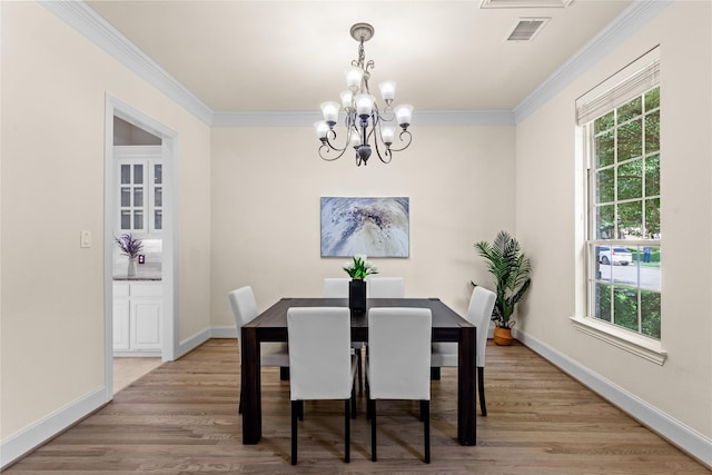 931 N Birdsong Dr, Allen, TX 75013 - dining space with a chandelier, crown molding, and light wood-type flooring