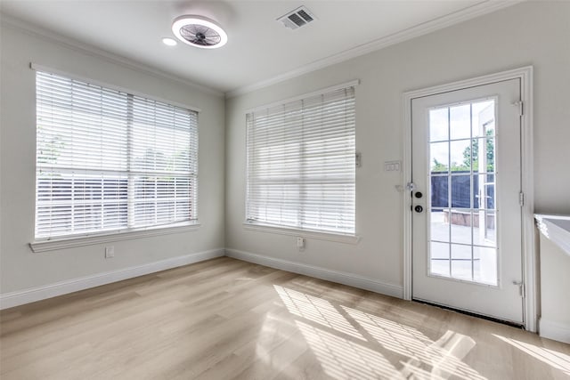 3214 Blair Oak Dr, Rowlett, TX 75089 - doorway to outside featuring healthy amount of natural light, ornamental molding, and light wood-style floors