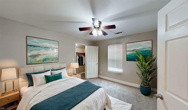 615 Royal Crest Dr, Mesquite, TX 75149 - bedroom with light carpet, a spacious closet, ceiling fan, and a closet