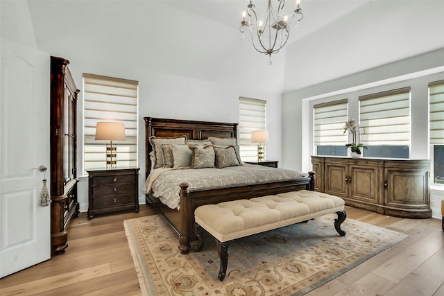 7432 Wispy Willow Ln, Little Elm, TX 76227 - bedroom featuring a chandelier and light wood-style flooring