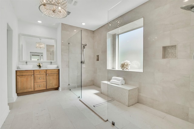 7432 Wispy Willow Ln, Little Elm, TX 76227 - full bathroom with walk in shower, double vanity, recessed lighting, and a chandelier