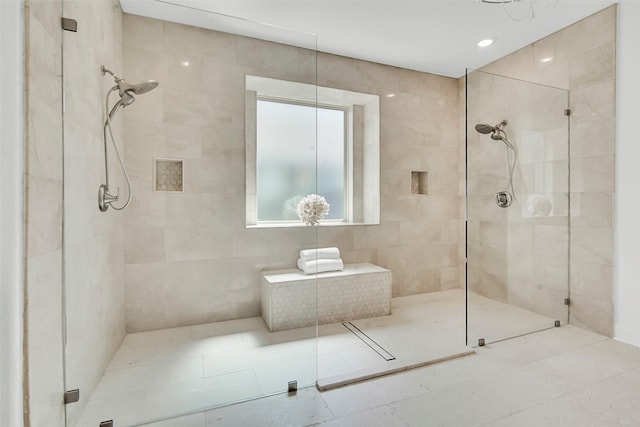 7432 Wispy Willow Ln, Little Elm, TX 76227 - bathroom with walk in shower, tile walls, and tile patterned floors