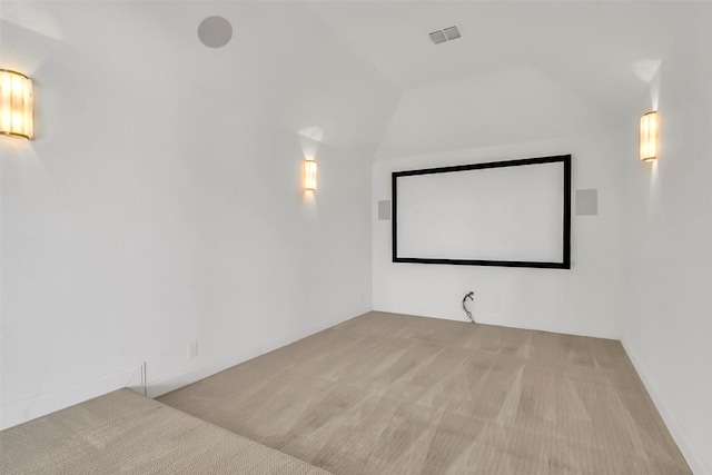 7432 Wispy Willow Ln, Little Elm, TX 76227 - carpeted home theater room featuring lofted ceiling