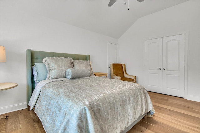 7432 Wispy Willow Ln, Little Elm, TX 76227 - bedroom featuring lofted ceiling, wood finished floors, a closet, and ceiling fan