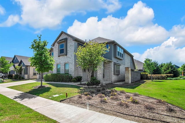 7432 Wispy Willow Ln, Little Elm, TX 76227 - view of front facade featuring a residential view, brick siding, and a front yard
