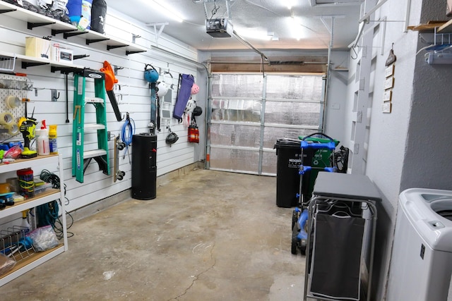3323 Wise Dr, Mesquite, TX 75150 - garage featuring a garage door opener and washer / clothes dryer