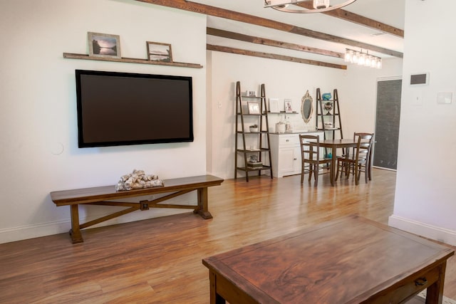 3323 Wise Dr, Mesquite, TX 75150 - living room featuring wood finished floors and beamed ceiling