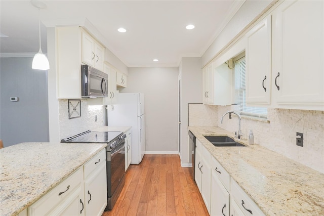 6306 Elmview Dr, Arlington, TX 76018 - kitchen featuring appliances with stainless steel finishes, ornamental molding, light wood-type flooring, light stone counters, and white cabinets