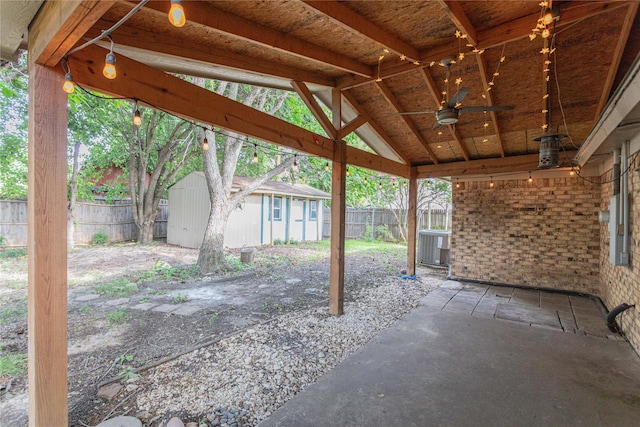 6306 Elmview Dr, Arlington, TX 76018 - fenced backyard with a ceiling fan, a patio area, and a shed