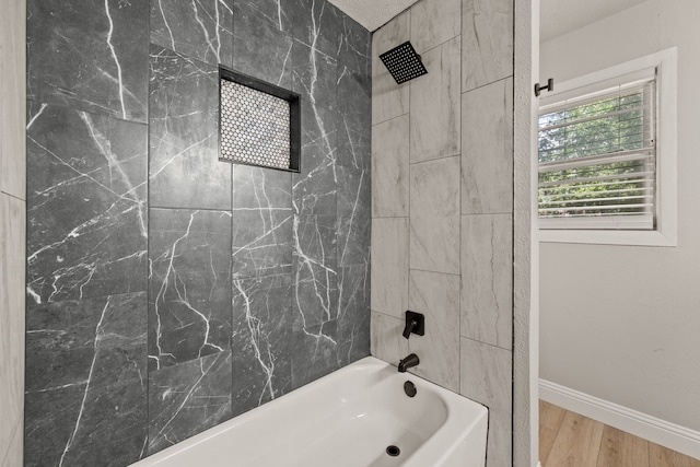 5120 Nadine Dr, Haltom City, TX 76117 - bathroom featuring shower / bathtub combination and wood finished floors