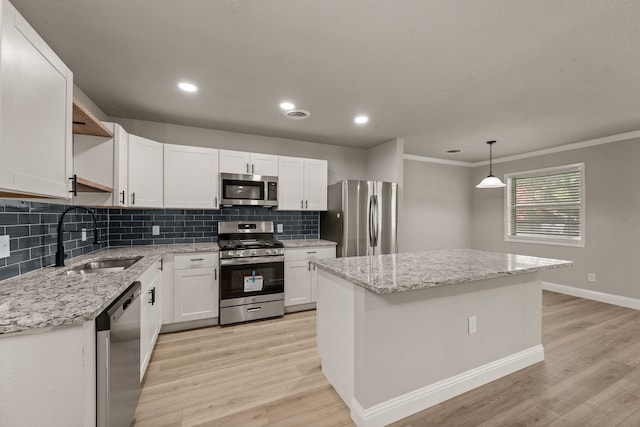 5120 Nadine Dr, Haltom City, TX 76117 - kitchen with stainless steel appliances, open shelves, light wood-style flooring, decorative backsplash, and white cabinetry