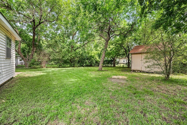 5120 Nadine Dr, Haltom City, TX 76117 - view of green lawn with a storage unit