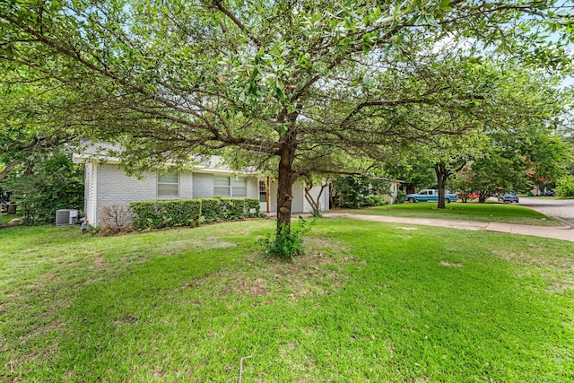 5120 Nadine Dr, Haltom City, TX 76117 - view of property hidden behind natural elements with driveway, brick siding, a front lawn, and an attached garage