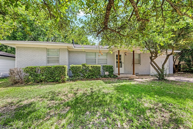 5120 Nadine Dr, Haltom City, TX 76117 - view of front of house with brick siding, a front yard, and a garage