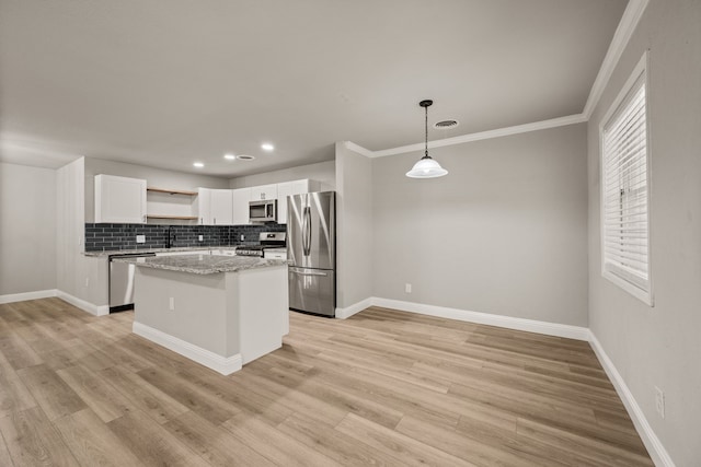 5120 Nadine Dr, Haltom City, TX 76117 - kitchen with appliances with stainless steel finishes, open shelves, white cabinetry, a center island, and light wood-type flooring