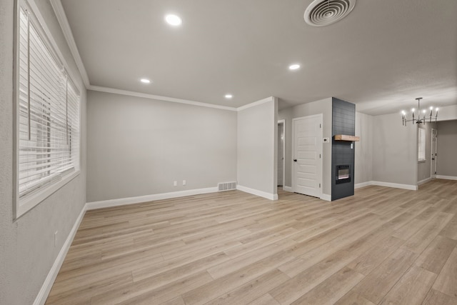 5120 Nadine Dr, Haltom City, TX 76117 - unfurnished living room with a chandelier, a fireplace, recessed lighting, light wood-style flooring, and ornamental molding