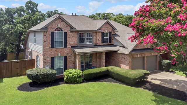 2807 Stonehurst Dr, Grapevine, TX 76051 - traditional-style house with brick siding, roof with shingles, and concrete driveway