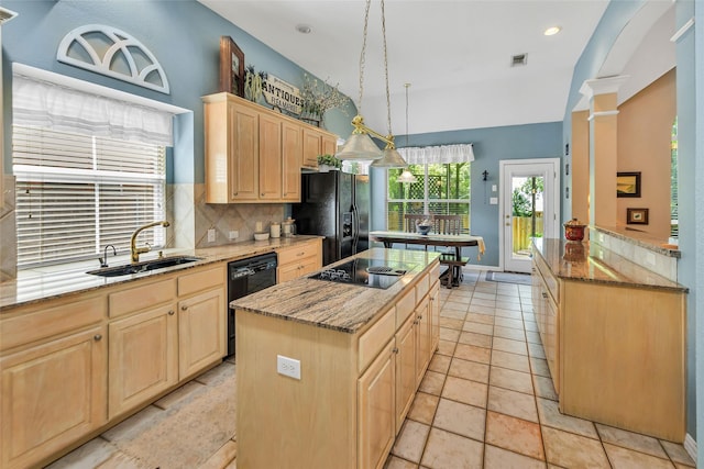 2807 Stonehurst Dr, Grapevine, TX 76051 - kitchen with light brown cabinets, black appliances, backsplash, a center island, and light stone counters