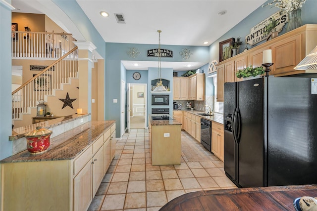 2807 Stonehurst Dr, Grapevine, TX 76051 - kitchen with black appliances, light brown cabinetry, a center island, backsplash, and dark stone counters