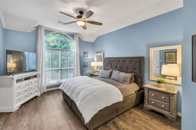 2807 Stonehurst Dr, Grapevine, TX 76051 - bedroom featuring crown molding, dark wood finished floors, and ceiling fan