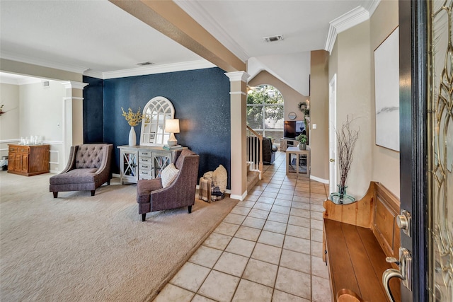 2807 Stonehurst Dr, Grapevine, TX 76051 - entryway with decorative columns, crown molding, light tile patterned floors, light colored carpet, and an accent wall
