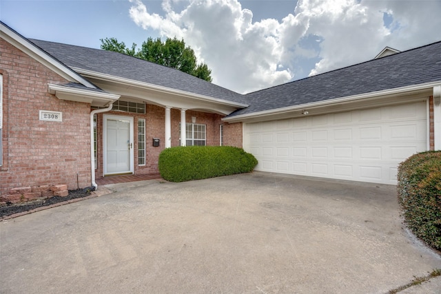 2308 Auburn Ct, Sherman, TX 75092 - view of front of home with brick siding, concrete driveway, a shingled roof, and an attached garage