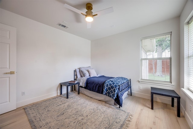 2308 Auburn Ct, Sherman, TX 75092 - bedroom featuring multiple windows, wood finished floors, and ceiling fan