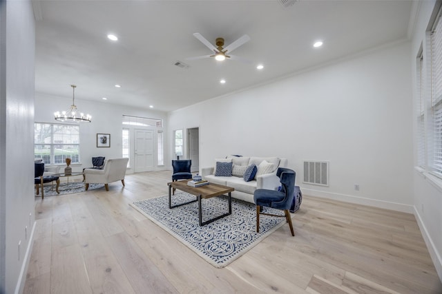 2308 Auburn Ct, Sherman, TX 75092 - living room featuring light wood-style floors, ceiling fan, recessed lighting, ornamental molding, and a chandelier
